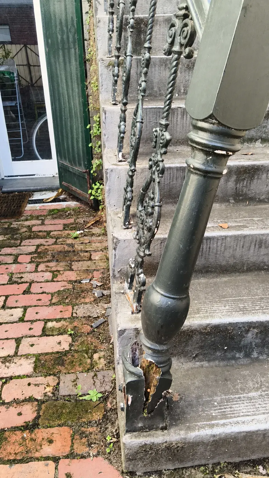 Split lower stair post and loose ornamental balustrade before repair